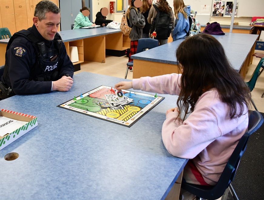 Cst. Varlet playing Sorry! with Spencer School Student!