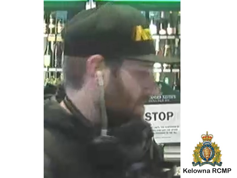side profile of suspect AWKWRD with black baseball cap, dark hoody and brown facial hair
