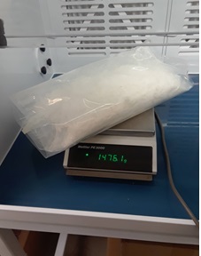 Plastic bag with suspected drugs and scale