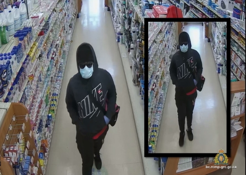 Two photographs which show the robbery suspect walking down an aisle inside the pharmacy;