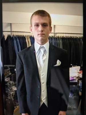 Photo of Michael Kitchener from 2018 in a suit