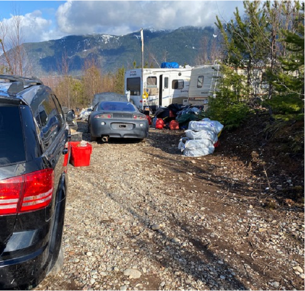 Campers and Vehicles with scattered debris