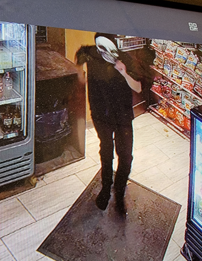 Front view suspect in black with skull mask