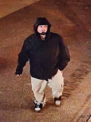 Male suspect wearing blck jacket and white pants