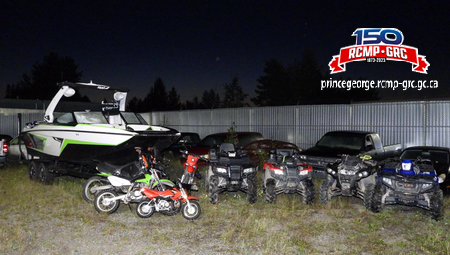 photo of the recovered property from the July investigation, showing the recovered boat, motorcycles and ATVs.