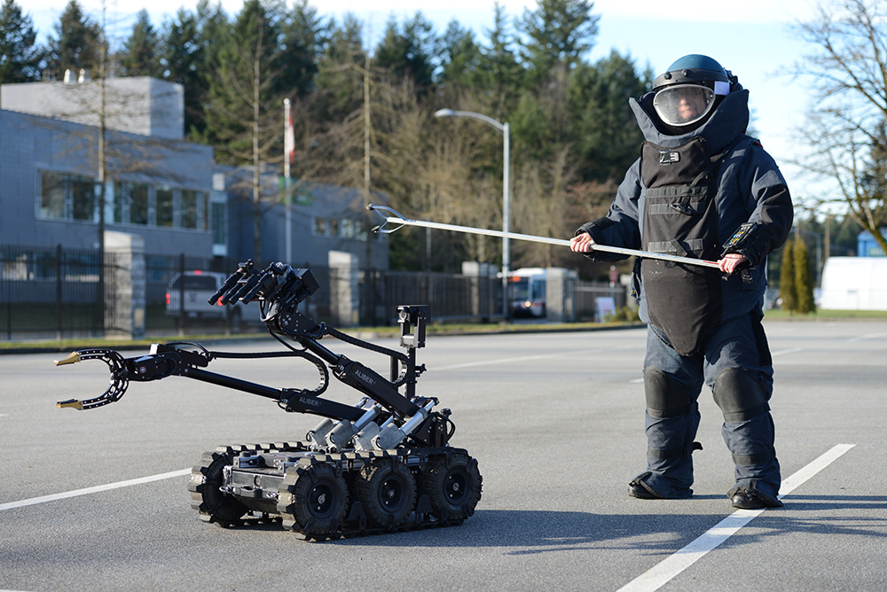 Photo of bomb suit and robot