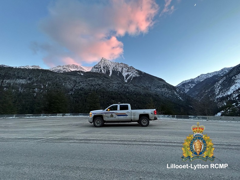 Pictured is an RCMP vehicle in front of Mt Brew during sunset. 